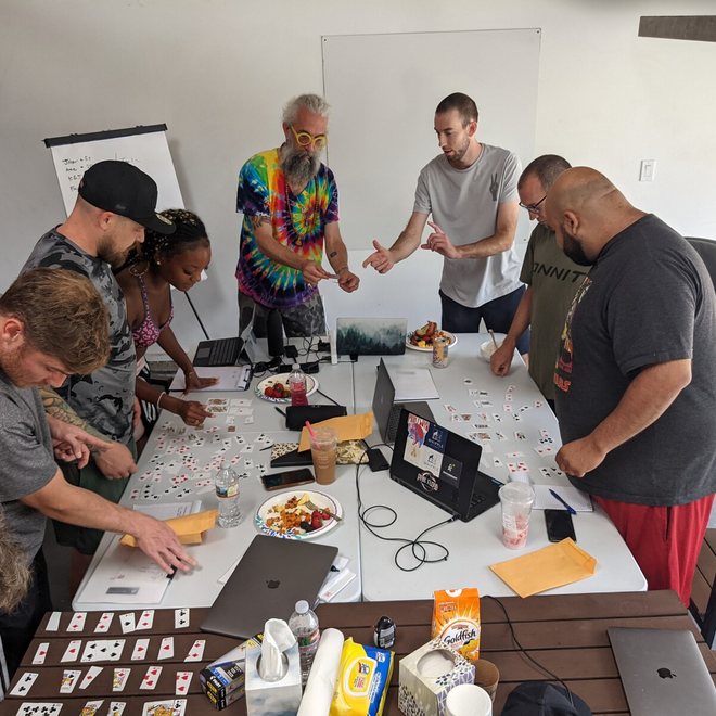 A team working around a table exercise