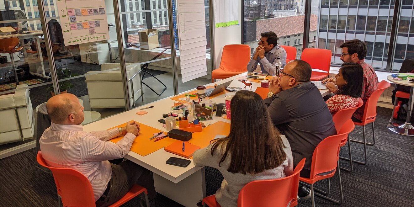 A leadership team working around a table