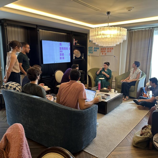 A team in discussion in a lounge setting