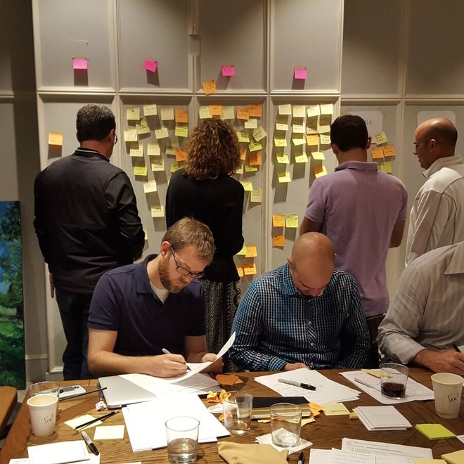 Leaders writing during a working session