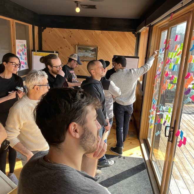 Leaders reviewing notes on glass doors