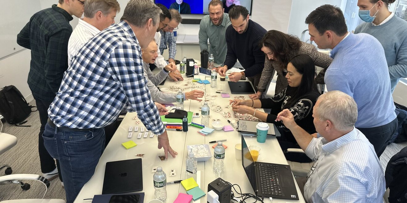 Leaders working together along a conference table