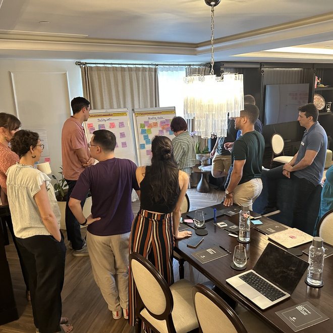 Leaders in a working session at a planning wall
